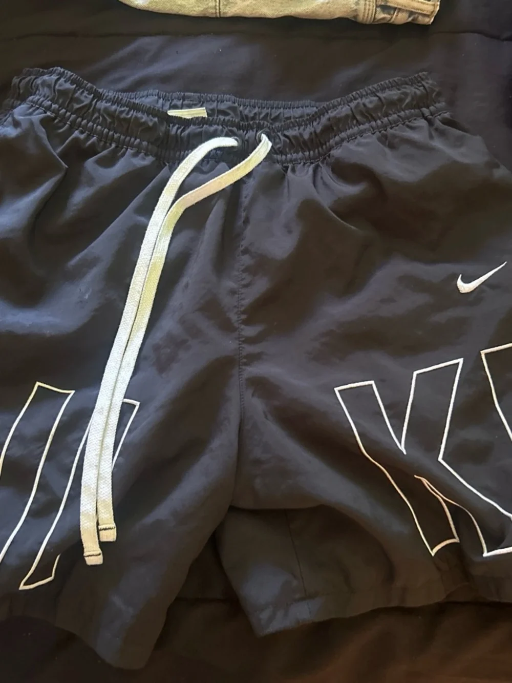 Nike Black Kids Athletic Shorts with White Drawstring and Logo